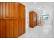 Spacious closet with custom wooden cabinets and white marble floors, providing ample storage at 1925 Beach Se Dr, St Petersburg, FL 33705