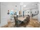 Elegant dining room with stylish lighting, water view, and seating for eight at 1925 Beach Se Dr, St Petersburg, FL 33705