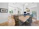 Open-concept dining area with natural light and views of the kitchen and living spaces at 1925 Beach Se Dr, St Petersburg, FL 33705