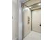 Interior view of home elevator with white walls and marble floors at 1925 Beach Se Dr, St Petersburg, FL 33705
