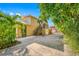View of the home's exterior showing a second story staircase and mature landscaping at 1925 Beach Se Dr, St Petersburg, FL 33705