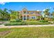 Beautiful two-story home featuring lush landscaping, a barrel tile roof, and a Mediterranean architectural style at 1925 Beach Se Dr, St Petersburg, FL 33705