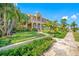 Inviting two-story home with a manicured lawn and Mediterranean-style architecture at 1925 Beach Se Dr, St Petersburg, FL 33705