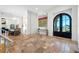 Grand foyer featuring high ceilings, tile flooring, and an arched doorway with beautiful views at 1925 Beach Se Dr, St Petersburg, FL 33705