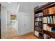 Hallway with stylish wood floors and a built-in bookcase adds charm and functionality to the home at 1925 Beach Se Dr, St Petersburg, FL 33705