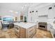 Modern kitchen featuring a large island, stainless steel appliances, and open access to dining and living areas at 1925 Beach Se Dr, St Petersburg, FL 33705