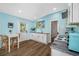 Cozy kitchenette features sleek, modern cabinets, light blue walls, and a dining space at 1925 Beach Se Dr, St Petersburg, FL 33705