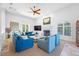 Spacious living room featuring comfortable seating, fireplace, and abundant natural light at 1925 Beach Se Dr, St Petersburg, FL 33705