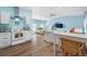 Open living space featuring a kitchenette and a bedroom-living room combo with bright light at 1925 Beach Se Dr, St Petersburg, FL 33705