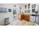 Mudroom area with views of the pool, storage cabinets, countertops, and travertine tile floors at 1925 Beach Se Dr, St Petersburg, FL 33705