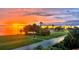 Sunset water view of neighborhood park; bright orange skies at 1925 Beach Se Dr, St Petersburg, FL 33705