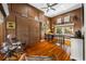 Spacious office with rich wood floors, a large desk, natural light and a rustic aesthetic at 1925 Beach Se Dr, St Petersburg, FL 33705