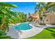 Backyard pool with tropical landscaping, a covered lanai, and artificial turf at 1925 Beach Se Dr, St Petersburg, FL 33705