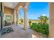 Inviting covered porch boasting stately columns and picturesque scenery beyond at 1925 Beach Se Dr, St Petersburg, FL 33705