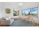 Bright sitting area with water views, comfortable furniture, and play equipment at 1925 Beach Se Dr, St Petersburg, FL 33705