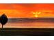 Water view featuring a sailboat and bright orange skies at sunset at 1925 Beach Se Dr, St Petersburg, FL 33705