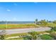 Scenic water view from the property showcasing the bay, palm trees, and blue sky at 1925 Beach Se Dr, St Petersburg, FL 33705