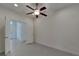 Bright bedroom with double doors and ceiling fan at 2226 Nottingham Greens Dr, Sun City Center, FL 33573