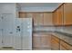 White refrigerator and light wood cabinets at 2226 Nottingham Greens Dr, Sun City Center, FL 33573