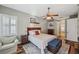 Main bedroom with wood flooring and a ceiling fan at 27200 Hawks Nest Cir, Wesley Chapel, FL 33544