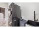 Laundry room with modern stacked washer/dryer at 27200 Hawks Nest Cir, Wesley Chapel, FL 33544