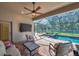 Relaxing screened-in pool and spa with outdoor seating at 27200 Hawks Nest Cir, Wesley Chapel, FL 33544