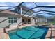 Large screened pool and patio with outdoor kitchen and spa at 27200 Hawks Nest Cir, Wesley Chapel, FL 33544