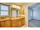 Bathroom vanity with marble countertop and wooden cabinetry at 2733 Cranbrook Ave, North Port, FL 34286