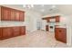 Spacious kitchen boasting ample cabinetry, granite counters, and white appliances at 3077 Regal Oaks Blvd, Palm Harbor, FL 34684