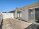 Private patio with white fence and sliding glass doors at 3263 38Th S St # B, St Petersburg, FL 33711