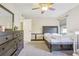 Bedroom with king bed, dresser, and additional closet space at 3407 King George Ln, Seffner, FL 33584