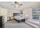 Bedroom with a king-size bed, crib, and ample closet space at 3407 King George Ln, Seffner, FL 33584