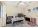 Cozy bedroom with a sofa, desk, and plenty of natural light at 3407 King George Ln, Seffner, FL 33584
