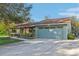 Charming home exterior with a well-maintained yard, inviting driveway, and two car garage at 3407 King George Ln, Seffner, FL 33584