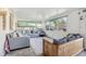 Relaxing sunroom featuring tile flooring, comfortable seating, and multiple windows providing plenty of natural light at 3407 King George Ln, Seffner, FL 33584