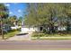 Single-story house with a gray roof, white walls, and a neatly landscaped lawn at 4003 W Euclid Ave, Tampa, FL 33629