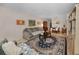 Comfortable living room with couches, table and decor flowing into the dining area at 4152 55 N Way # 1030, Kenneth City, FL 33709