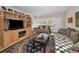 Cozy living room features warm tones, comfortable seating, and a large window with natural light at 4152 55 N Way # 1030, Kenneth City, FL 33709