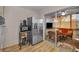 Cozy sunroom with seating area, TV, and sliding glass door to the kitchen at 4152 55 N Way # 1030, Kenneth City, FL 33709