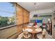 Sunroom with dining table, chairs and outdoor views at 4152 55 N Way # 1030, Kenneth City, FL 33709