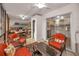 Spacious sunroom with lounge furniture and a view into the kitchen and dining areas at 4152 55 N Way # 1030, Kenneth City, FL 33709