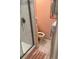Small bathroom with toilet, shower, and pink walls at 4199 38Th S Ave # I, St Petersburg, FL 33711