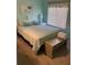 Bedroom with queen-size bed and light blue walls at 4199 38Th S Ave # I, St Petersburg, FL 33711