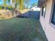 Backyard with wooden fence and grass at 5105 Garden Vale Ave, Tampa, FL 33624