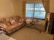 Bedroom with sofa, ironing board and mirror at 5105 Garden Vale Ave, Tampa, FL 33624