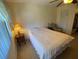 Cozy bedroom with a comfortable bed, bedside table, and closet for ample storage at 5105 Garden Vale Ave, Tampa, FL 33624