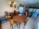 Dining room with wood table and four chairs, plus decorative hutch for elegant dining experience at 5105 Garden Vale Ave, Tampa, FL 33624