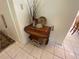 Elegant entryway features a decorative serving cart with charming decor and tile flooring at 5105 Garden Vale Ave, Tampa, FL 33624