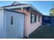Side of house with storage shed and partially visible screened patio at 5105 Garden Vale Ave, Tampa, FL 33624