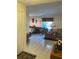 Combined living and dining area with tiled floors and comfortable furniture at 5105 Garden Vale Ave, Tampa, FL 33624